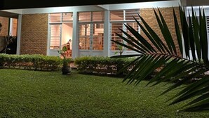 A modern building with large windows and a well-maintained lawn. - Choose Kigali (Kigali)
