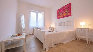 Family Apartment, Multiple Bedrooms (Casa Al Caprifoglio 600m From Beach) | 2 bedrooms, iron/ironing board, WiFi, bed sheets