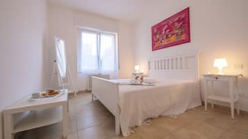 Family Apartment, 2 Bedrooms (Casa Al Caprifoglio 600m From Beach) | 2 bedrooms, iron/ironing board, WiFi, bed sheets