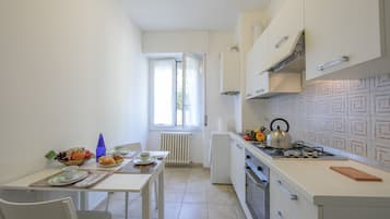 Family Apartment, 2 Bedrooms (Casa Al Caprifoglio 600m From Beach) | Private kitchen | Fridge, microwave, oven, stovetop