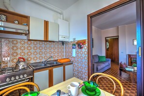 Family Apartment, Multiple Bedrooms, Mountainside (Nicoletta's Lake View Stresa) | Private kitchen | Full-sized fridge, microwave, oven, stovetop - Nicoletta's Lake View Stresa (Stresa)