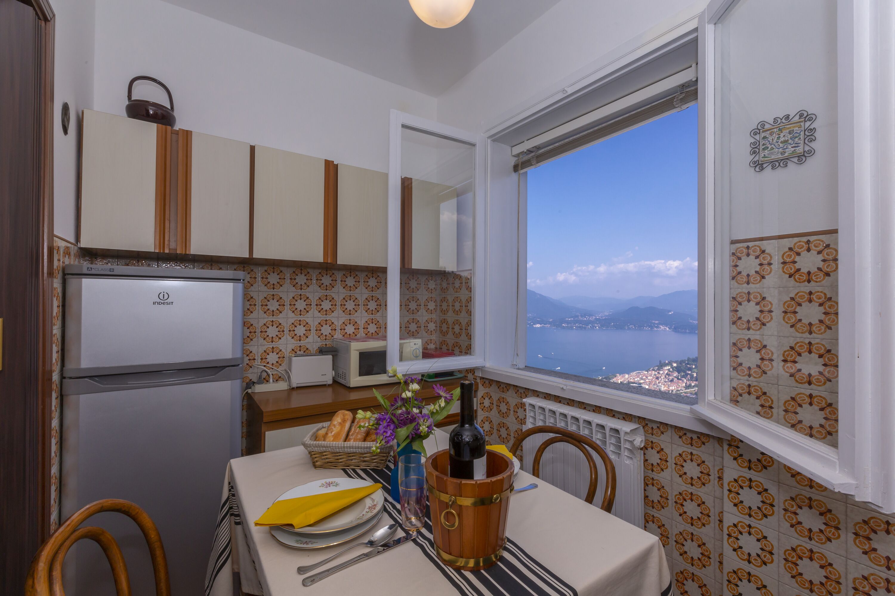 Family Apartment, Multiple Bedrooms, Mountainside (Nicoletta's Lake View Stresa) | Private kitchen | Full-sized fridge, microwave, oven, stovetop