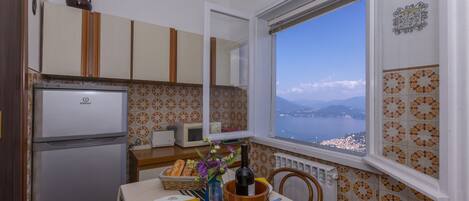 Family Apartment, Multiple Bedrooms, Mountainside (Nicoletta's Lake View Stresa) | Private kitchen | Full-size fridge, microwave, oven, stovetop