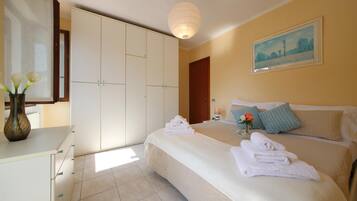 Family Apartment, 1 Bedroom (Petalo Bianco 100m from lake) | 1 bedroom, iron/ironing board, free WiFi, bed sheets