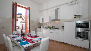 Family Apartment, Multiple Bedrooms, Lakeside (Residenza Gardenia Lake View Luino) | Private kitchen | Full-sized fridge, microwave, oven, stovetop