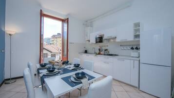Family Apartment, Multiple Bedrooms, Lakeside (Residenza Oleandro Lake View Luino) | Private kitchen | Full-size fridge, microwave, stovetop, dishwasher