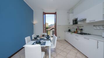 Family Apartment, 2 Bedrooms, Lakeside (Residenza Oleandro Lake View Luino) | Private kitchen | Full-size fridge, microwave, stovetop, dishwasher