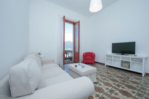 Family Apartment, Multiple Bedrooms, Lakeside (Residenza Oleandro Lake View Luino) | Living area | 22-inch flat-screen TV with digital channels, TV - Residenza Oleandro Lake View Luino Center (Luino)