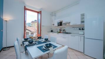 Family Apartment, 2 Bedrooms, Balcony, Lakeside (Residenza Oleandro - Lake View) | Private kitchen | Full-sized fridge, microwave, stovetop, dishwasher