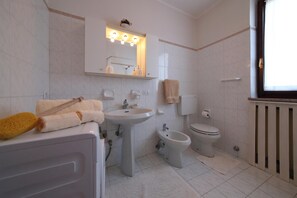 Family Apartment, 1 Bedroom (Sunset in Baveno) | Bathroom | Combined shower/tub, rainfall showerhead, hair dryer, bidet