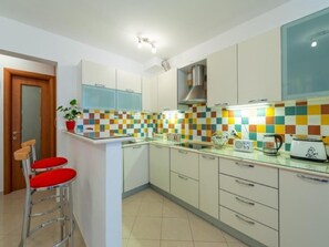 Apartment (Two-Bedroom Apartment with Terrace) | Private kitchen | Fridge, oven, coffee/tea maker, electric kettle