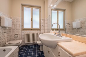 Bathtub, hair dryer, towels