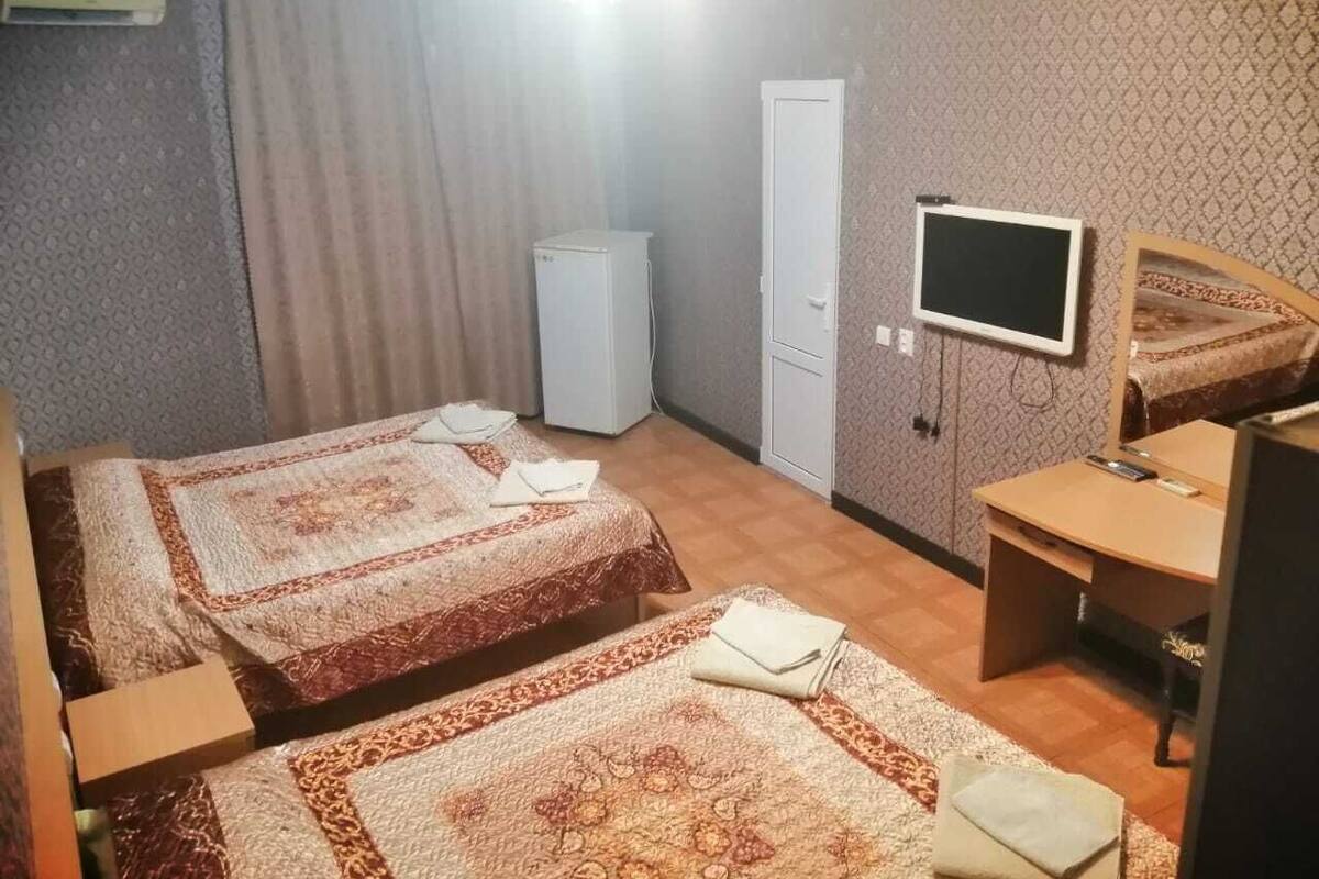 Desk, blackout curtains, bed sheets