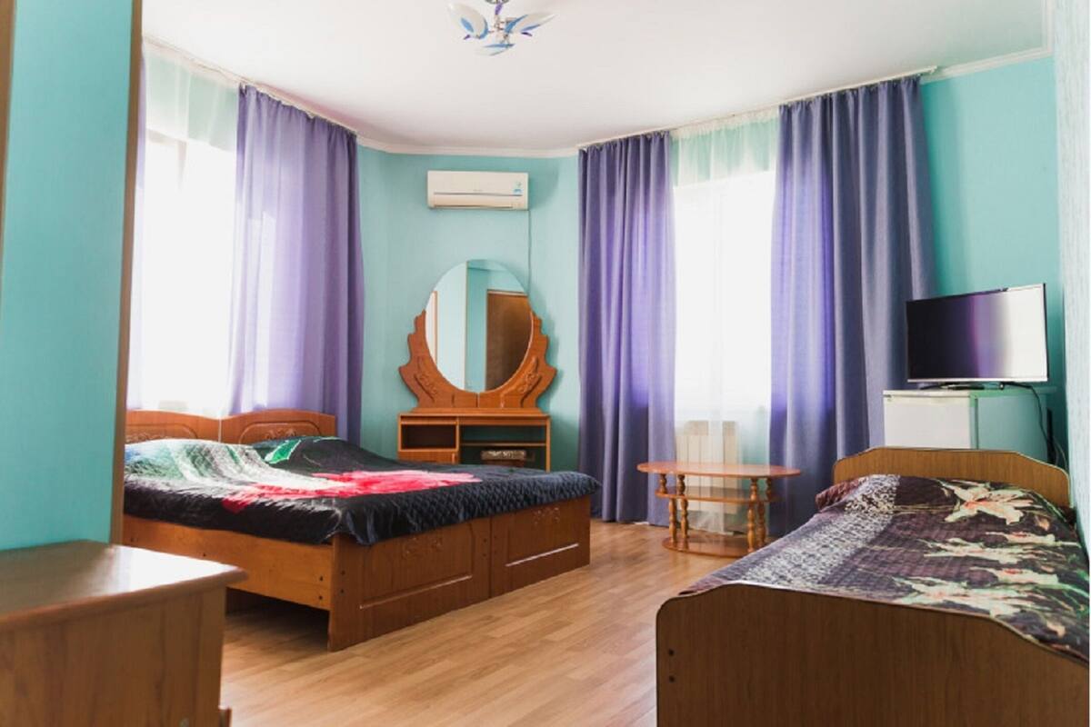 Desk, blackout curtains, bed sheets
