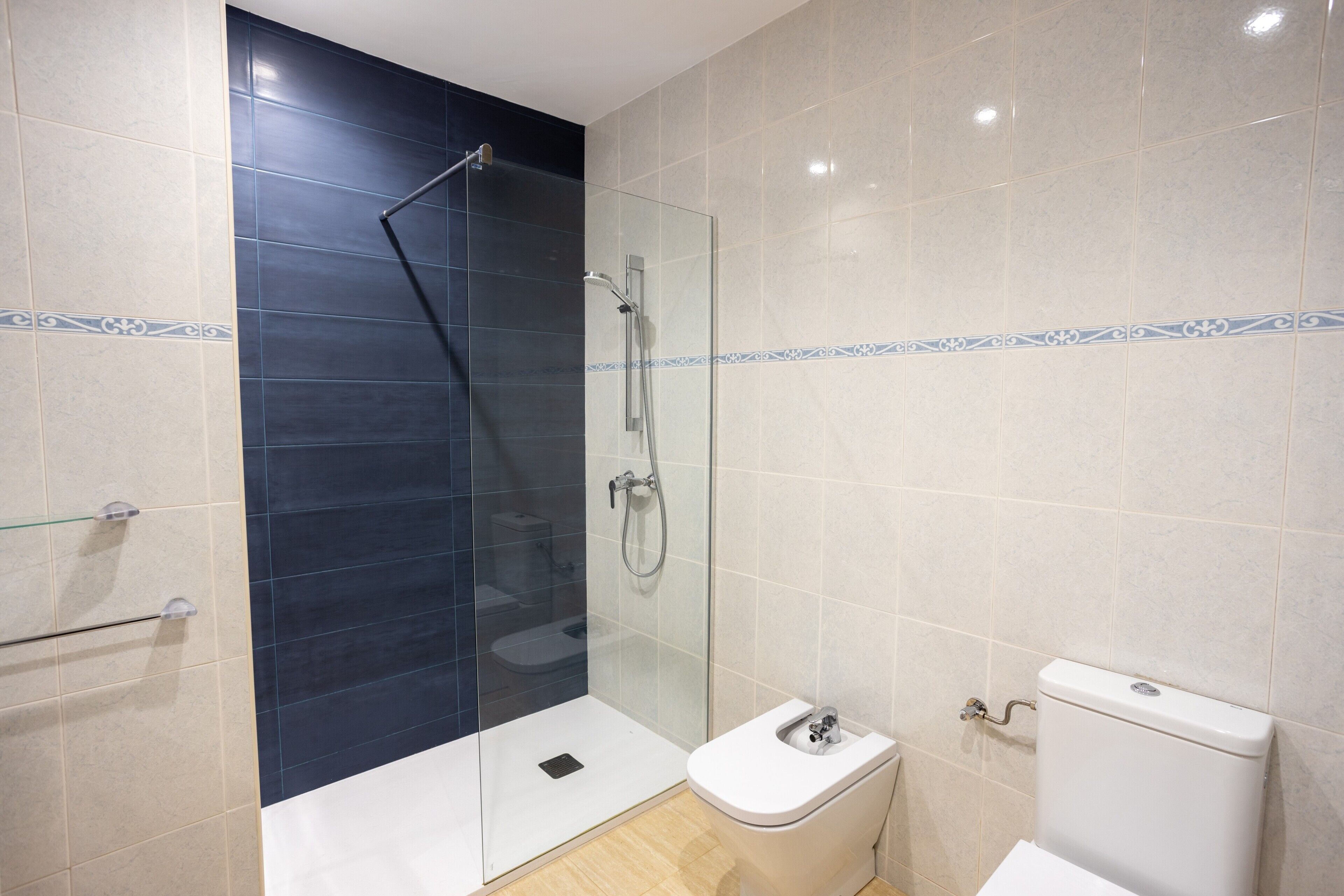 Bathtub, hair dryer, towels