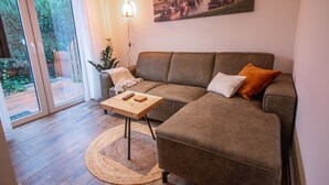 Apartamento | Zona de estar | Televisión de pantalla plana de 60 pulgadas con canales por satélite