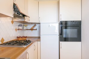 Fridge, stovetop, electric kettle, toaster