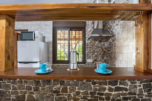 Fridge, microwave, stovetop, coffee/tea maker