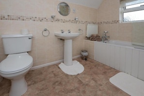 Combined shower/tub, hair dryer, towels, toilet paper