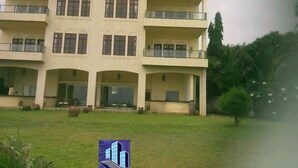 A multi-story building with balconies and large windows. - Sun Paradise Nyali (Mombasa)