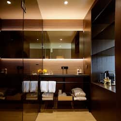 Designer toiletries, hair dryer, bathrobes, slippers