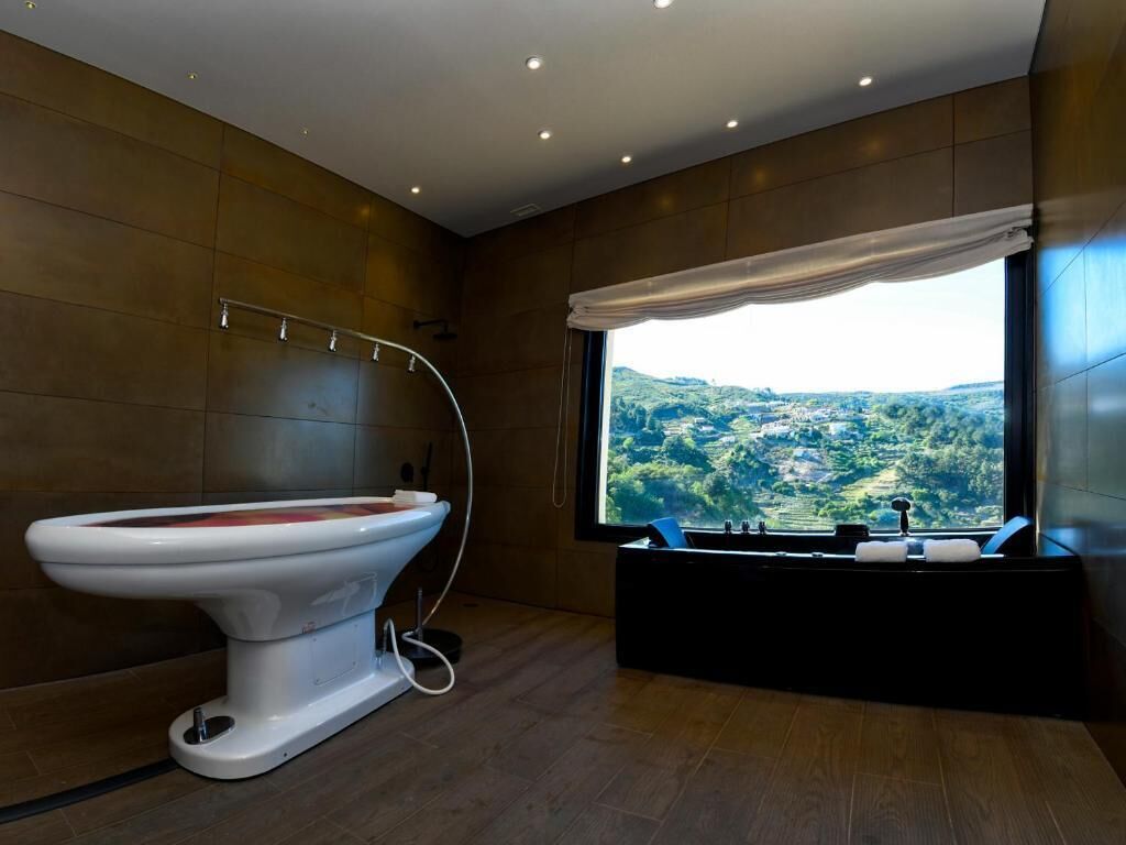 designer toiletries, hair dryer, bathrobes, slippers