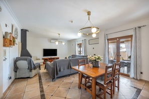 TV, fireplace - Rustic Holiday Home "Los Tres Soles" with Pool, Terraces & Wi-Fi (PORTOCOLOM)