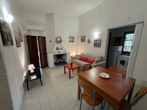 TV, fireplace - Holiday Home Near the Beach with WiFi, Garden and Terrace; Pets Allowed (Geremeas Residence)
