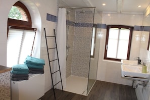 Bathtub, hair dryer, towels, soap