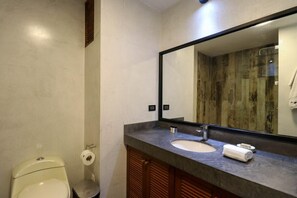 A modern bathroom with a toilet, sink, and mirror. - w* | Bright 3BR with Ocean View (Lima)