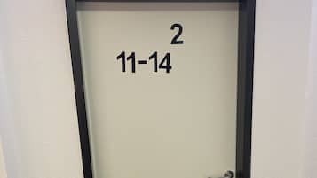 A door with a black frame and a number "2" above it, indicating room number.