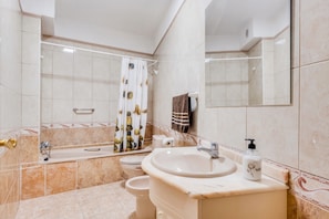 Bathtub, hair dryer, towels