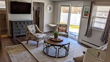 Smart TV, fireplace, table football, books