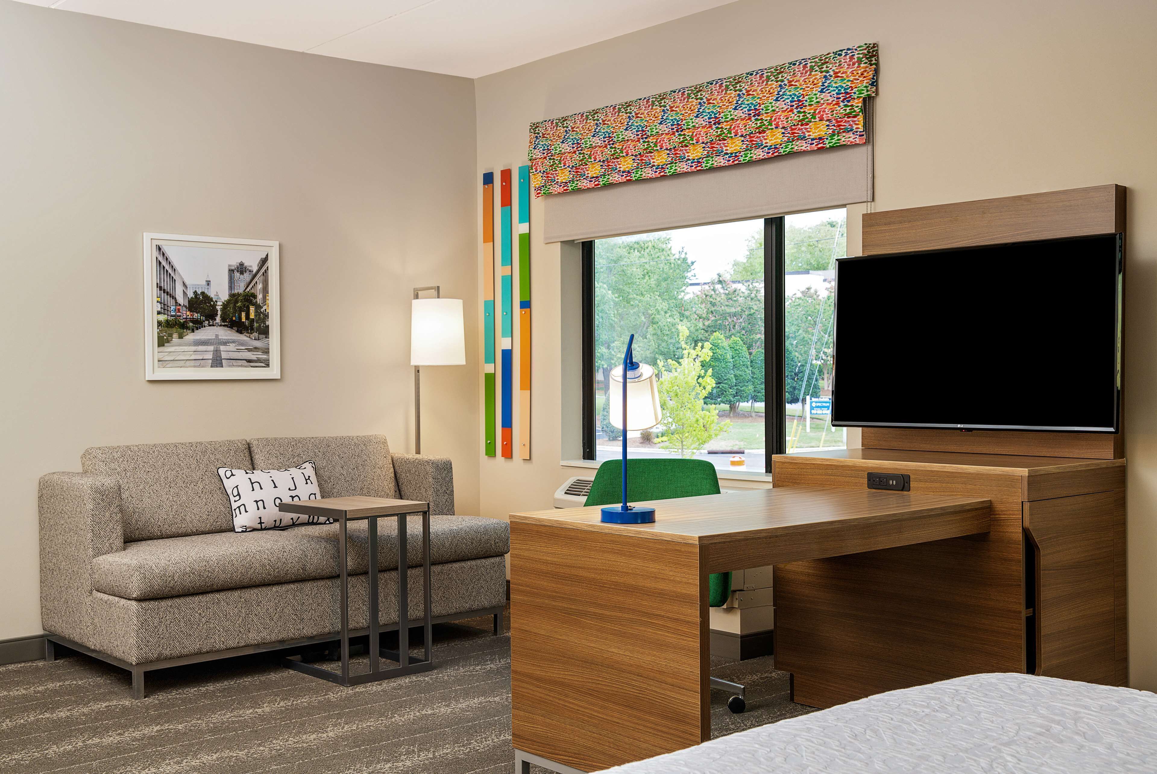 suite, 1 king bed, non smoking, corner | in-room safe, desk, laptop workspace, blackout curtains