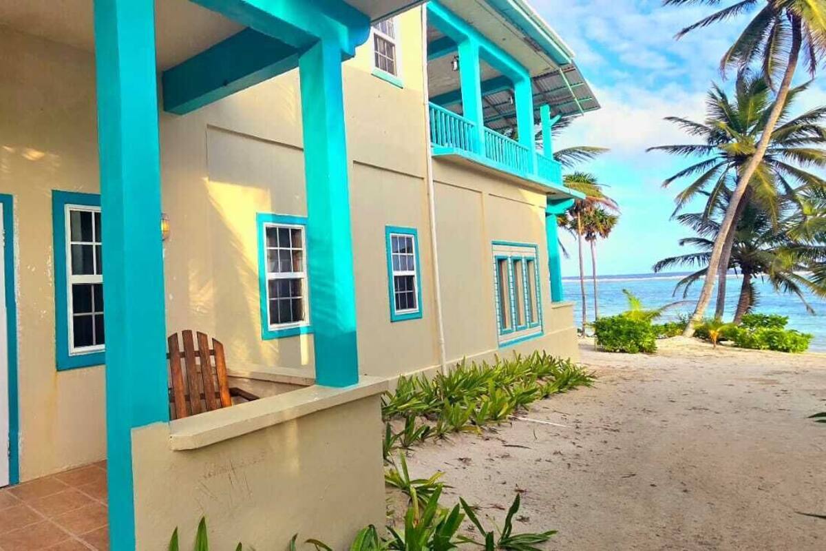 A beachfront hotel with a sign reading "Royal Tower."