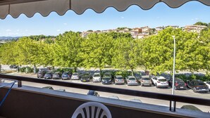 A balcony with a view of a parking lot and a residential area. - S220 - Sirolo, three-room apartment in the center with terrace (Sirolo)