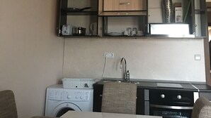 Fridge, stovetop, cookware/dishes/utensils - Elite Apartments is located in the old town of Pomorie (Pomorie)
