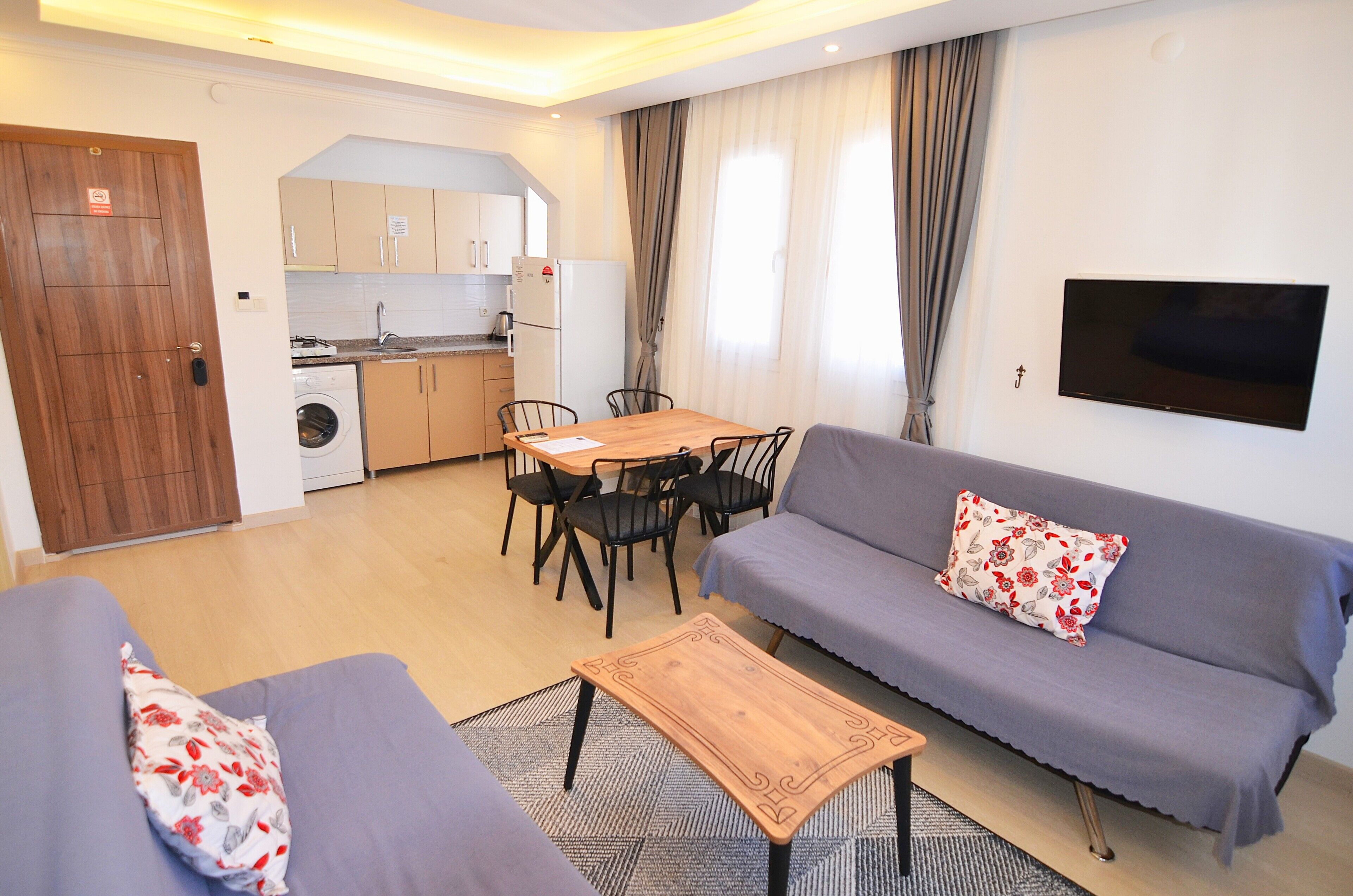 family apartment, 1 bedroom | living area | 32-inch lcd tv with satellite channels