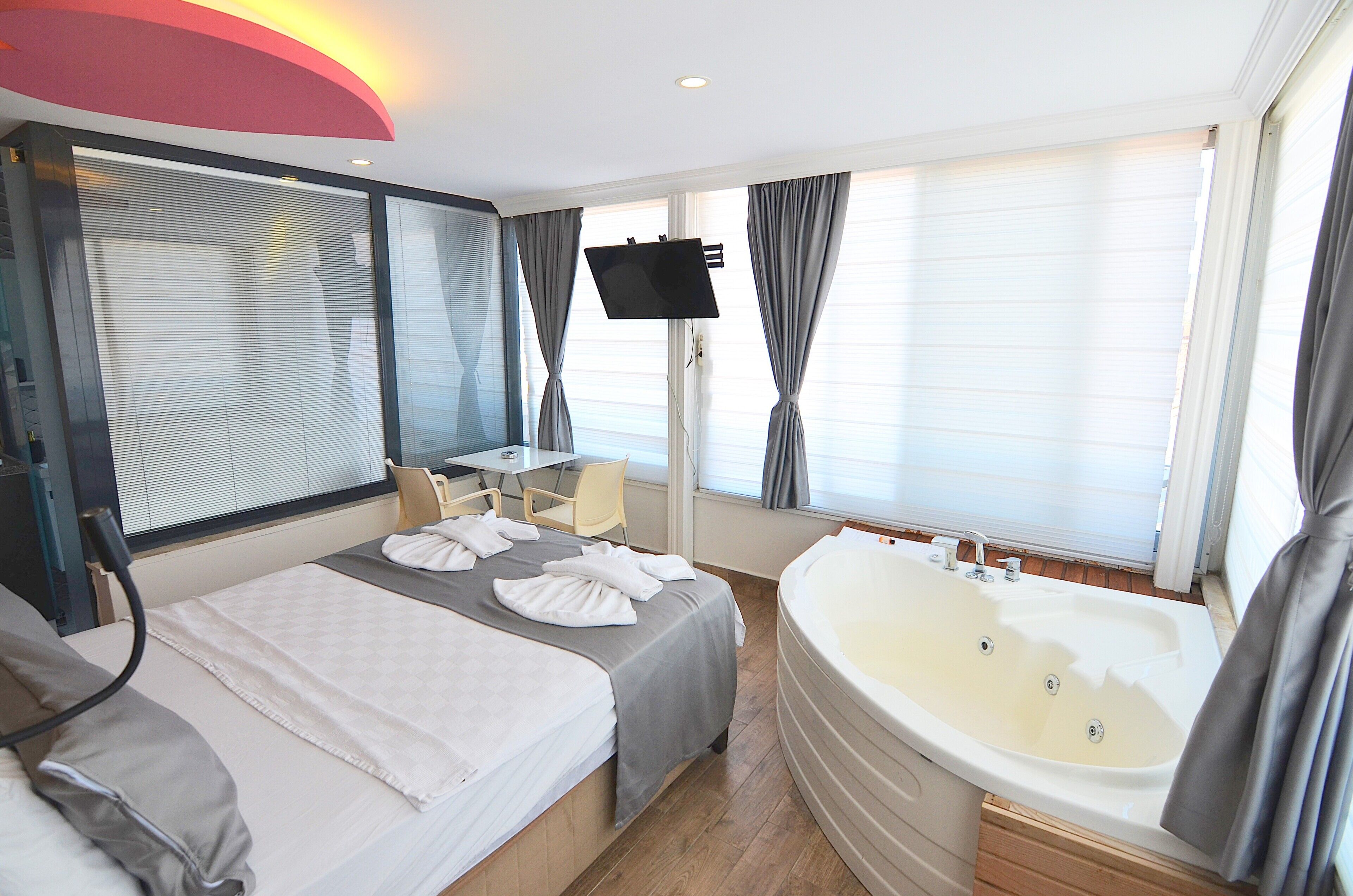 romantic double room, 1 bedroom, jetted tub, sea view | 1 bedroom, premium bedding, select comfort beds, desk