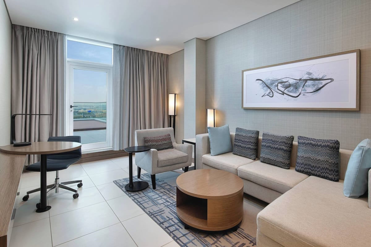 Premium Suite, 1 Bedroom, City View | Living room | 55-inch flat-screen TV with satellite channels, TV, pay movies