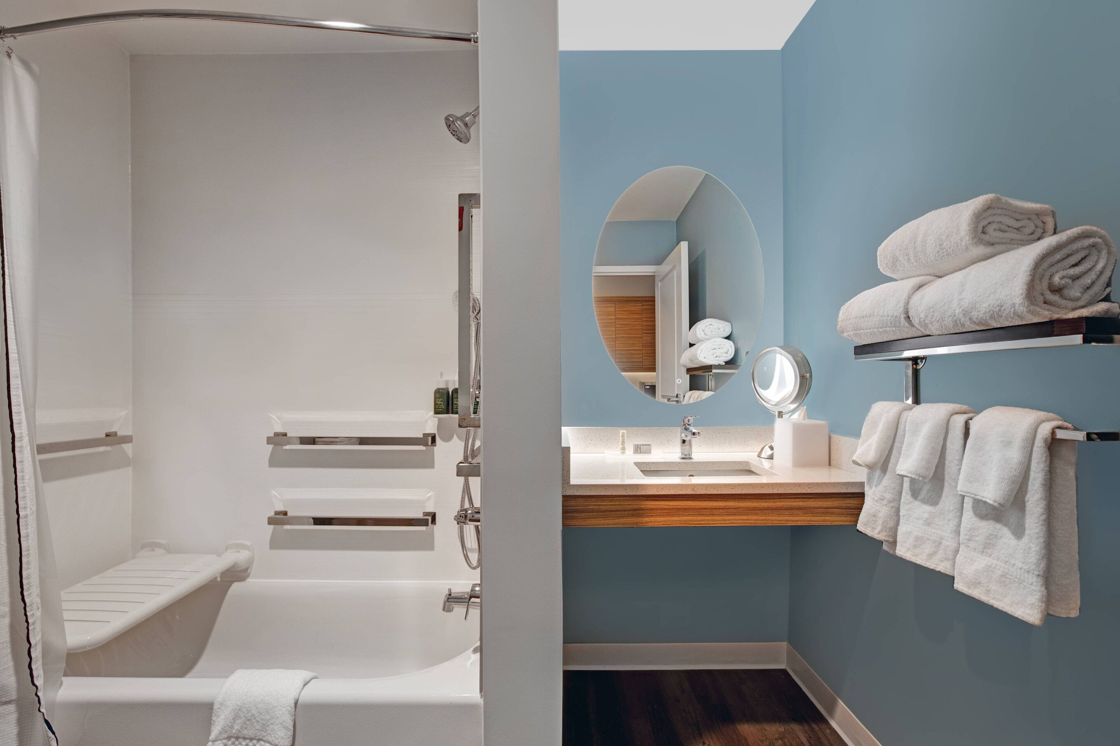 designer toiletries, hair dryer, towels