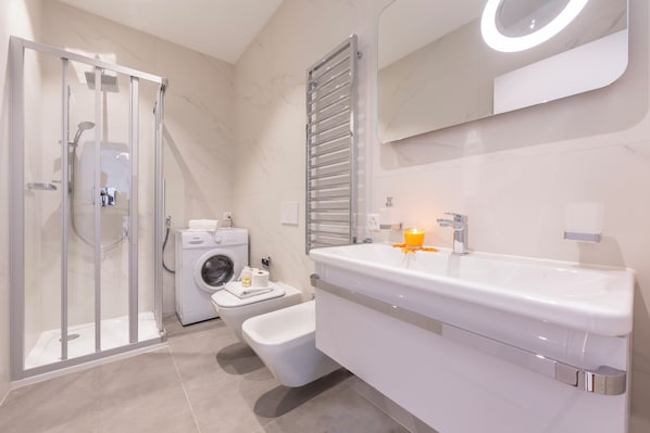 Family Apartment, 1 Bedroom, Balcony (Heart of Lugano) | Bathroom | Shower, rainfall showerhead, free toiletries, hair dryer