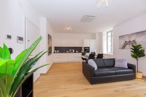 Family Apartment, 1 Bedroom (Heart of Lugano) | Living area | 22-inch flat-screen TV with digital channels, TV, heated floors