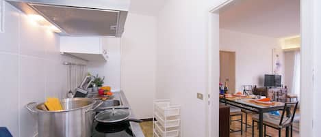 Family Apartment, Multiple Bedrooms (Kiki House) | Private kitchen | Full-sized fridge, microwave, oven, stovetop