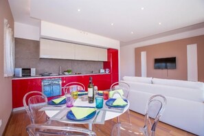 Apartment, 1 Bedroom | Private kitchen | Full-sized fridge, microwave, oven, stovetop - La Perla del Ticino Attico (Lugano)
