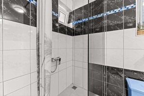 Bathtub, hair dryer, towels