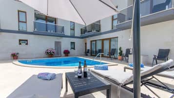 Outdoor pool, pool umbrellas, pool loungers