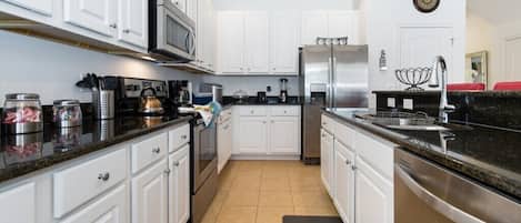 Villa | Private kitchen | Fridge, microwave, dishwasher, cookware/dishes/utensils