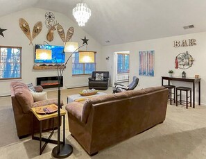 Smart TV, fireplace, video game console, table football