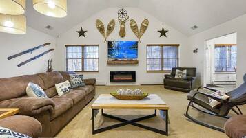 Smart TV, fireplace, video game console, table football